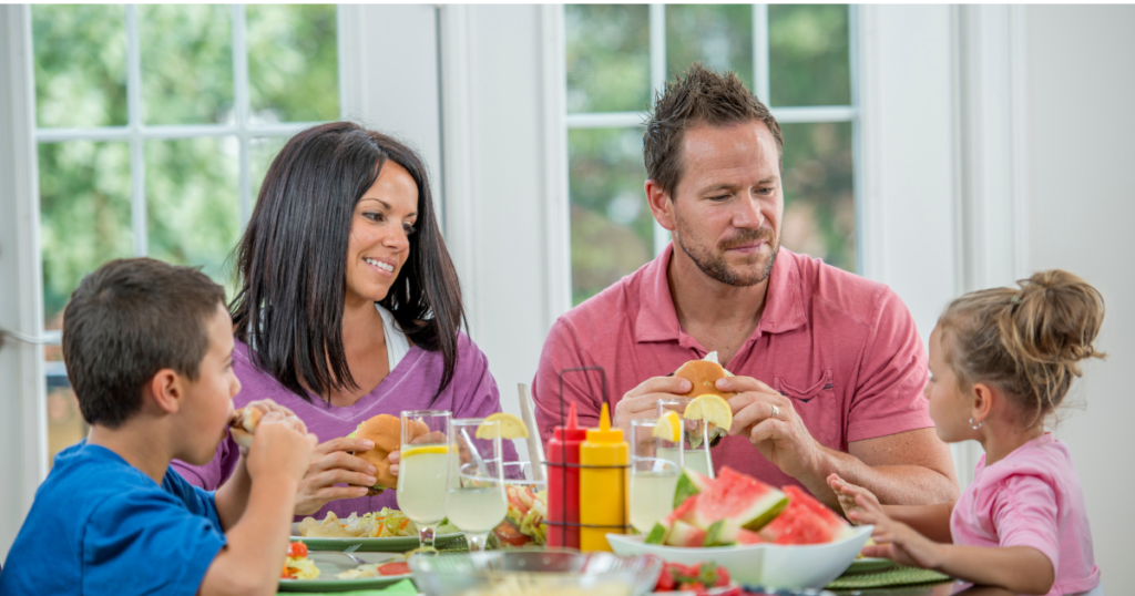 This picture shows a family having dinner together 