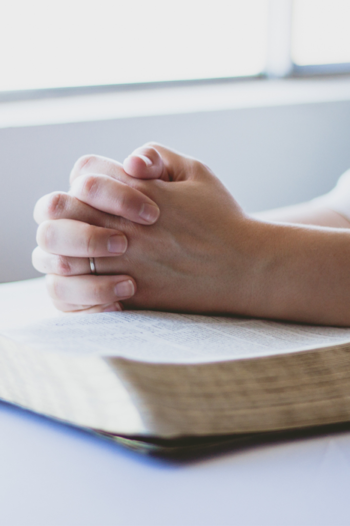 Praying Hands on a bible